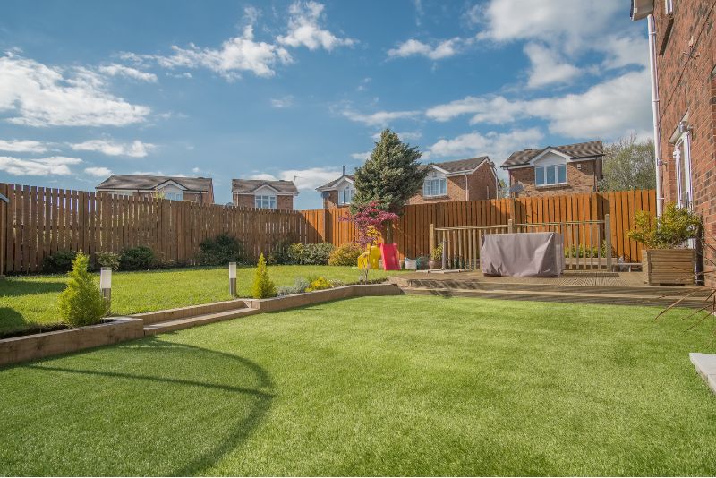 An outdoor space that has been landscaped with grass and paveways