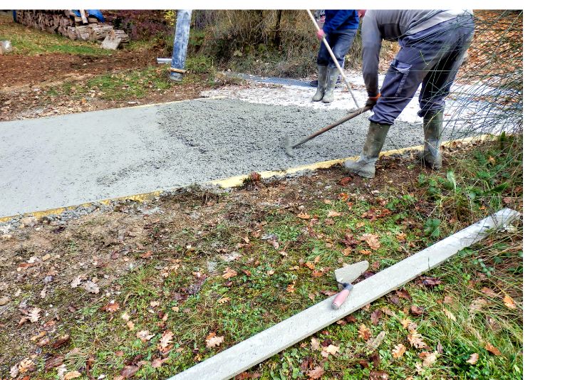A picture of two people who are doing a pavement construction